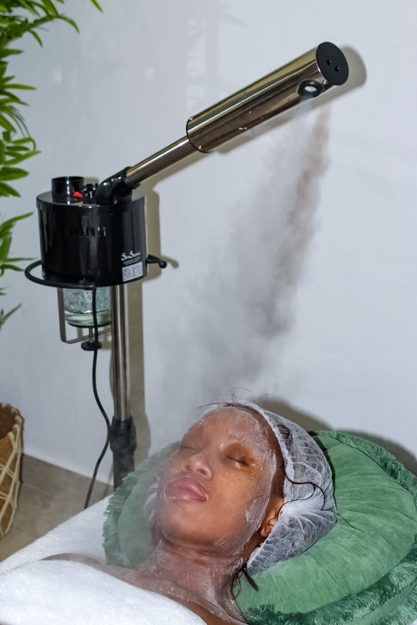 Client receiving a steam facial treatment at Botanica Spa Olivedale